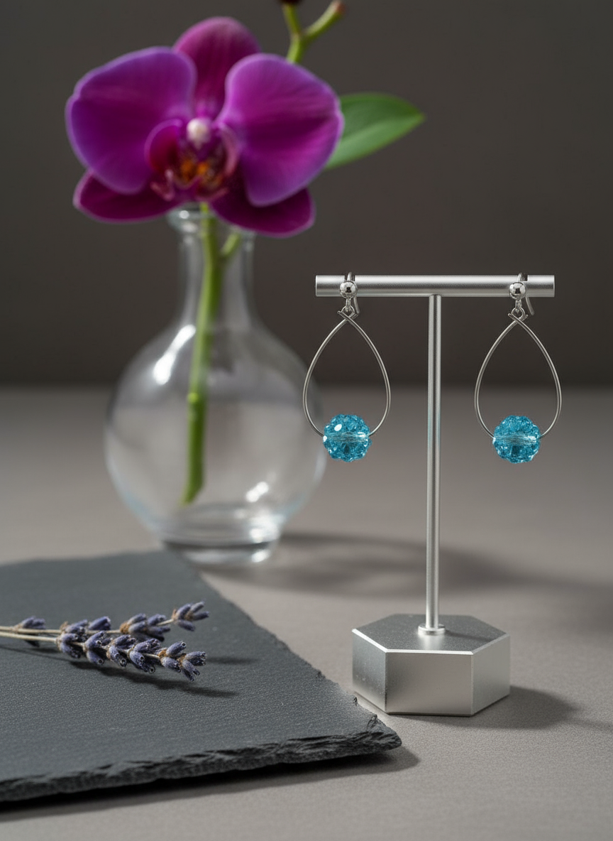 Glittriga ovala creoler med turkos strass, örhängen i strass